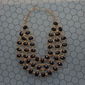 Gold and black necklace and earrings